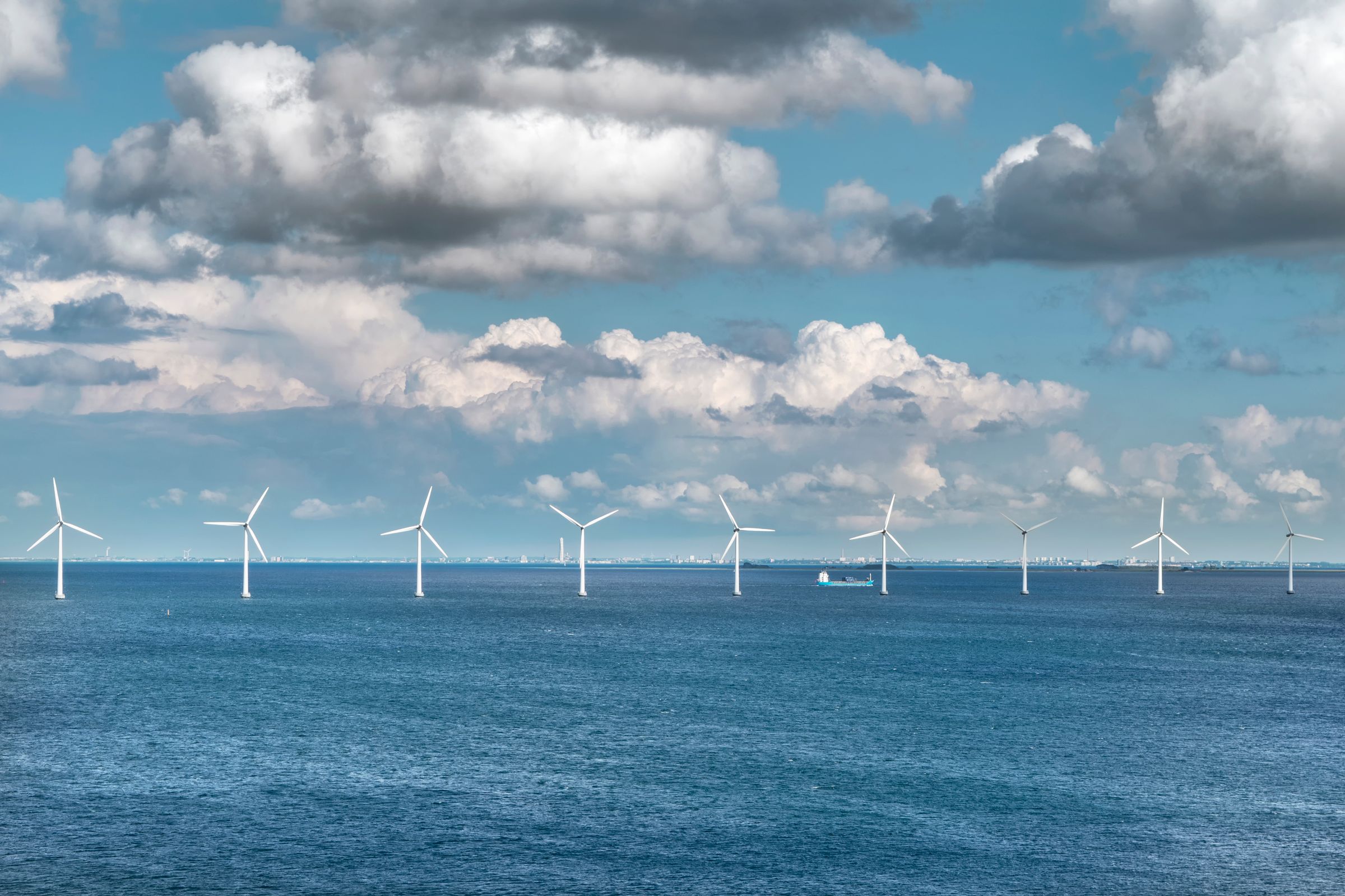 Offshore wind turbines at sea on a clear day