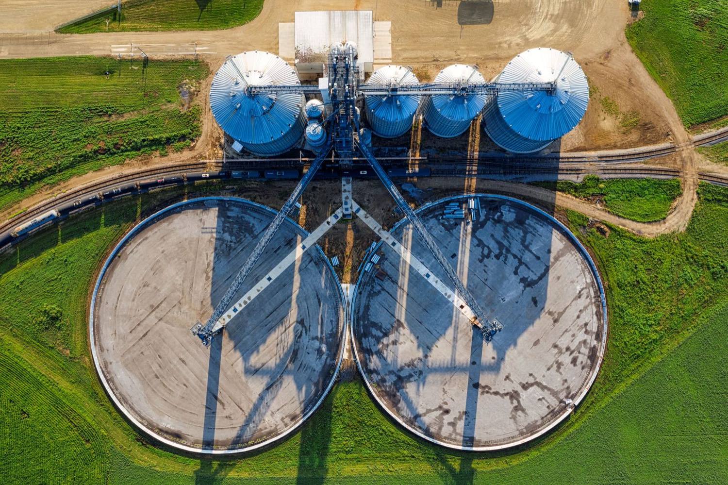 Aerial view of a water treatment facility with circular tanks